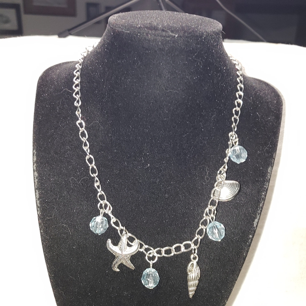 Beach Theme Silvertone Necklace with starfish, Conch & clam shells & blue beads